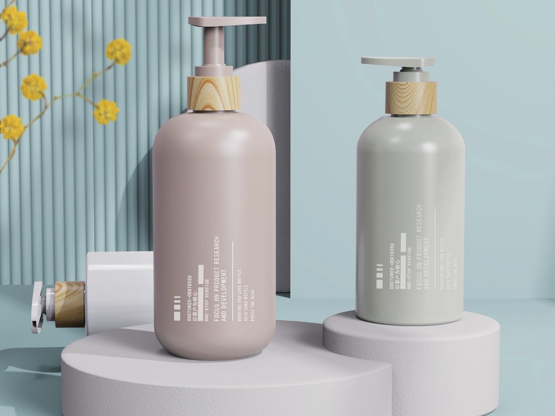 White foaming pump bottles on a soft blue set