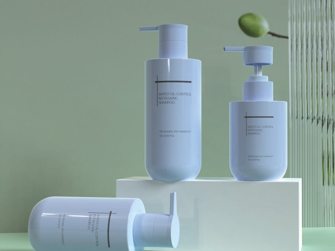 Soft mint green bottles on a white stone plinth