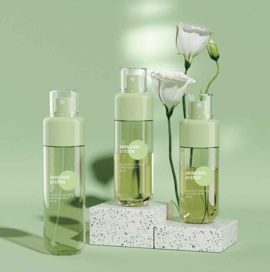 Pale green spray bottles with white lisianthus on a soft green set