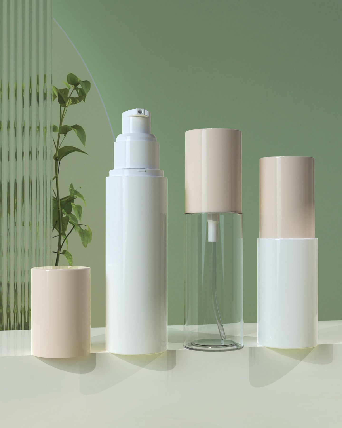 Cosmetic bottles and airless pumps on a sage studio set